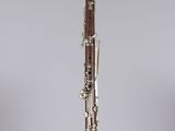 a close up of a clarinet on a clear surface