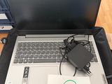 a laptop computer sitting on top of a black bag