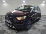 a picture of a dark colored car parked in a showroom