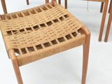 four chairs that are sitting next to each other