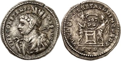 a silver coin with an image of a man on it