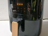 an air fryer that is sitting on a counter