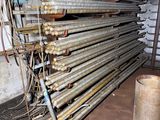 a pile of pipes and pipes in a room