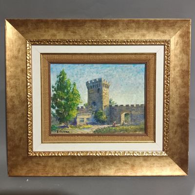 un tableau représentant un château, encadré d'or, accroché au mur