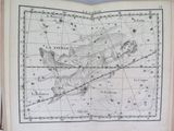 an old book with a map of the sky and constellations on it