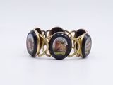 an image of a close up of a bracelet with a picture on it