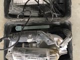 two tools in the case on the floor next to each other
