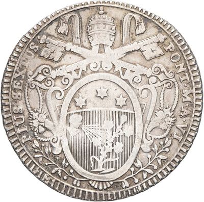 an old silver coin with a coat of arms and a shield on it