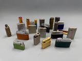 a lot of lighters that are sitting on a table