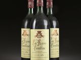 three bottles of wine sitting on top of a table next to each other