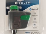 a close up of a bluetooth device in a package on a white surface