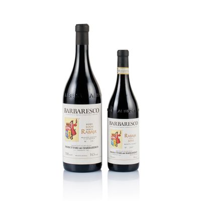 two bottles of wine sitting next to each other on a white surface
