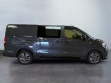 the van is parked in the garage with its door open