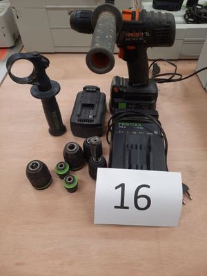 a picture of a corded drill and other tools on a table