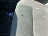 a small hole in the front seat of a car