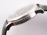 an image of a close up of a watch on a white surface