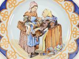 a plate with a picture of two women and a donkey on it