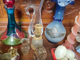 many different vases and bowls on the table