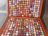 a wooden case with a lot of buttons in it