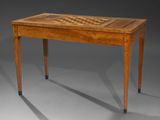 a wooden table with a chess board on top of it