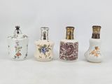 four different types of vases are lined up on a white surface