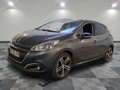 the grey car is parked on a checkered tile floor