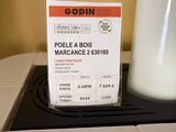 a picture of a bottle of milk and a ticket on a counter