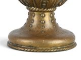 a gold vase with a flower on it on a white background