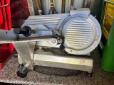 an image of a meat slicer sitting on a counter