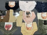 a lot of panties that are sitting on a bed