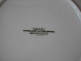 a white plate that has a black and white label on it