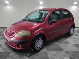 a picture of a red car parked on a checkered floor