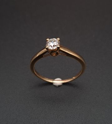 Bague solitaire en or jaune 18K (750‰) ornée d'un diamant ta…