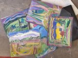 many different paintings on the ground next to each other