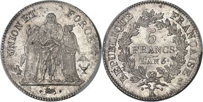 a silver coin with an image of a woman and a man on it