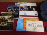 a lot of movies and dvds on a red table