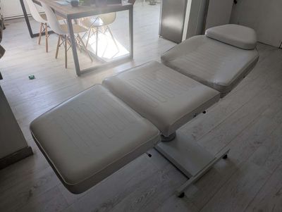 a room with a table, chairs, and a couch in it