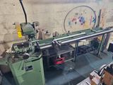 a machine that is working on a piece of wood