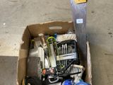a box full of tools sitting on the floor