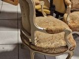 two chairs that are sitting on a tile floor