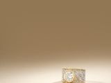 an image of a diamond ring on a beige background