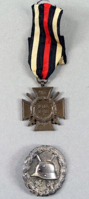 three medals and a medal on a white surface