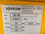 a close up of a yellow machine with a label on it