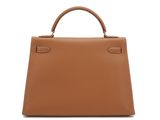 a brown leather handbag on a white background