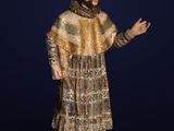 a statue of a man with a beard and a dress