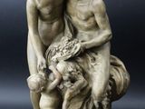 an image of a statue of two men and a dog
