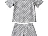 a close up of a shirt and shorts on a white background