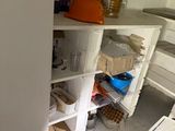 a small pantry with a lot of food in it