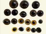 an image of a group of different colored eyes on a white surface