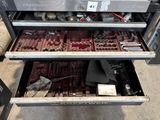 a drawer full of assorted tools in a warehouse